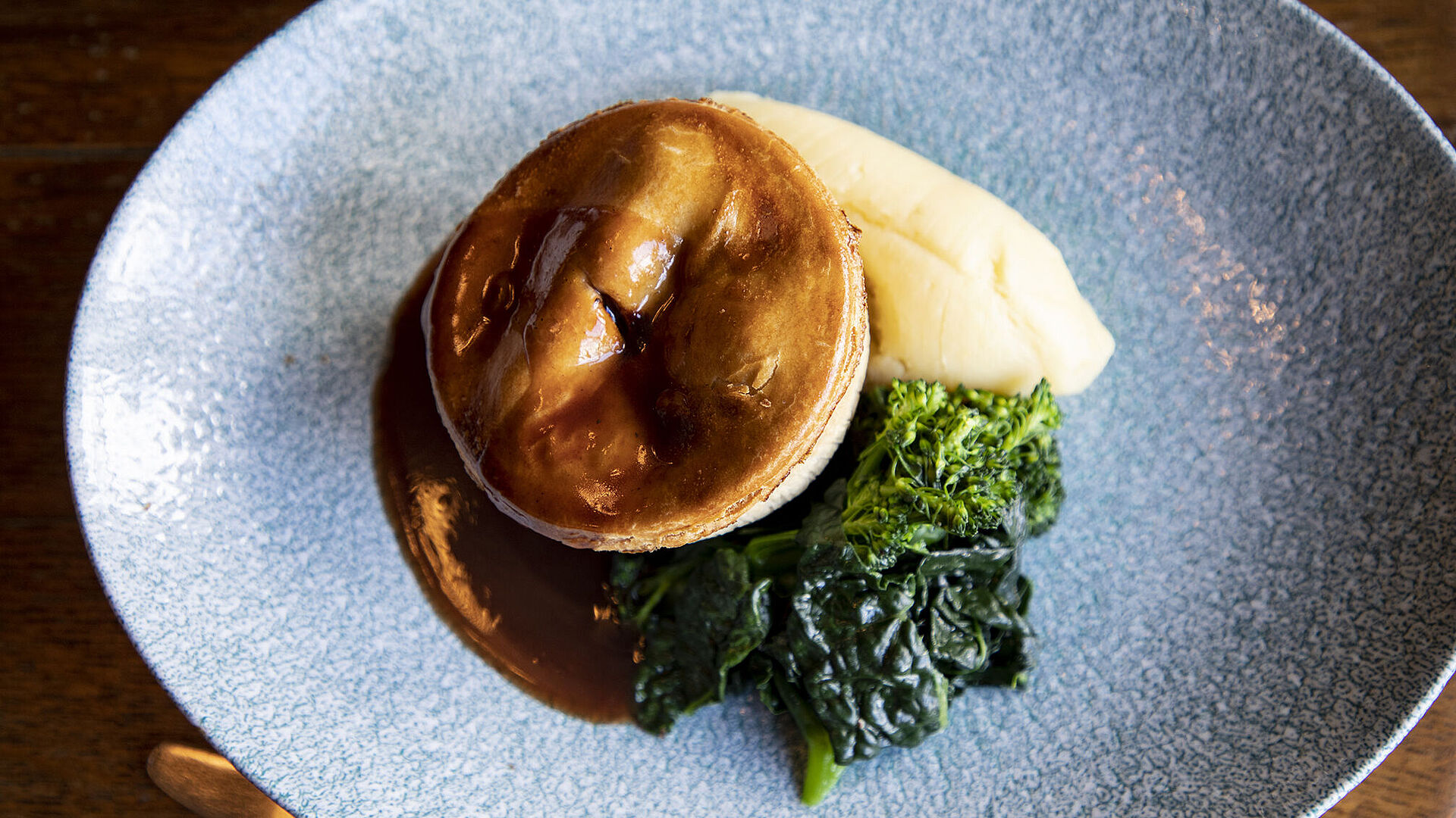 Pie and vegetables with a pint of 6X